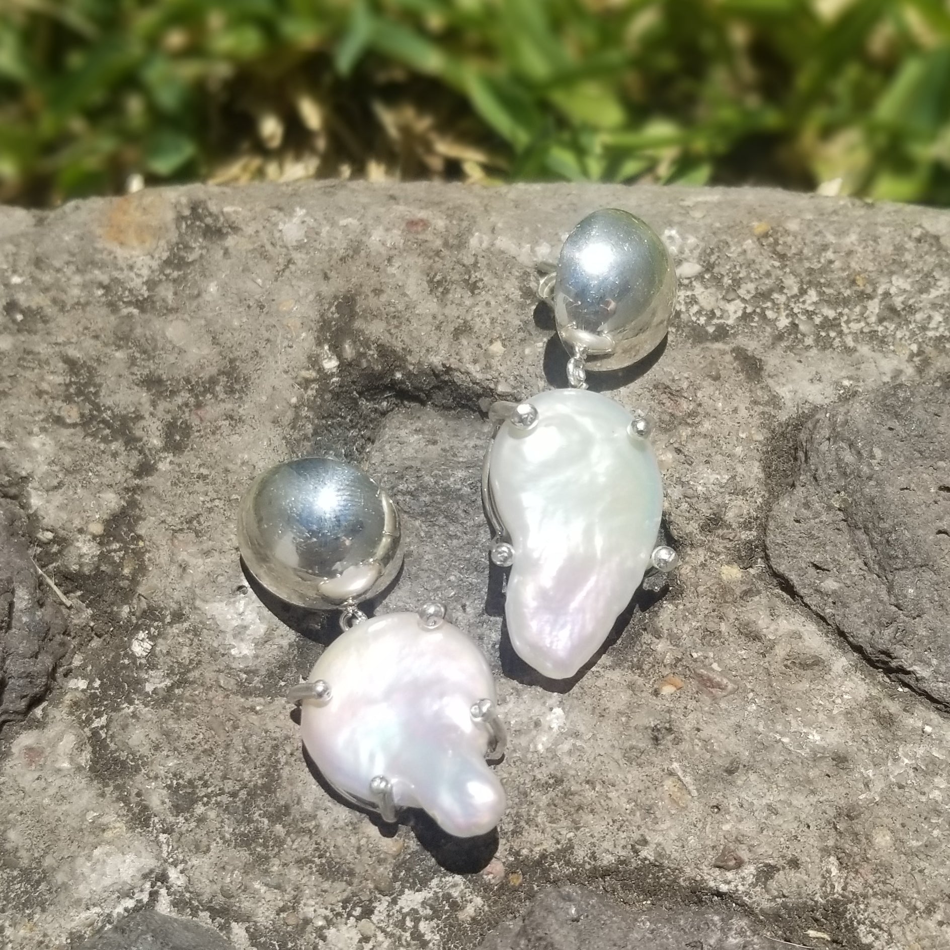 Plain sterling silver earrings with perfect picked natural baroque pearl.