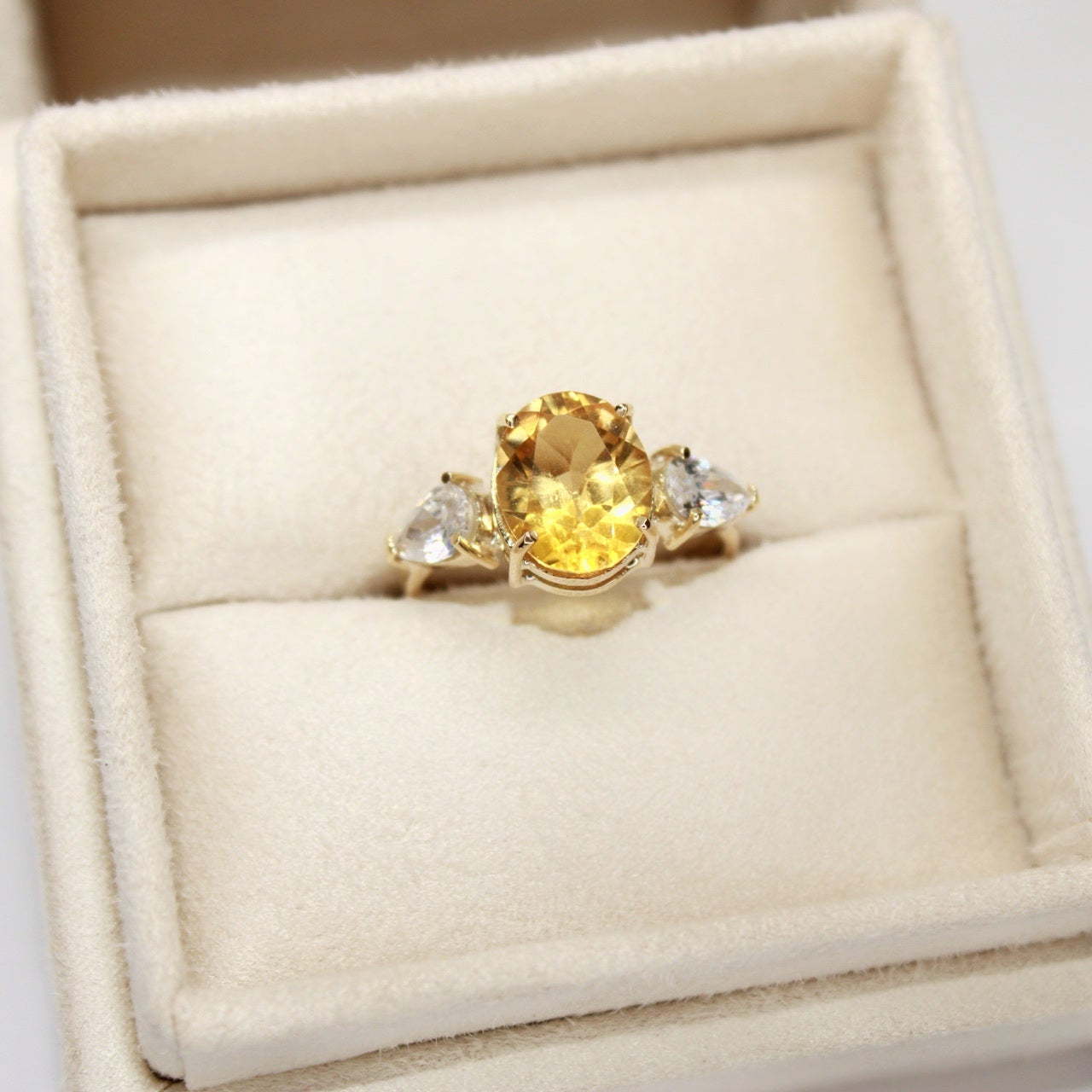 Three-Stone Engagement Ring in Yellow Gold with Orange Zirconia