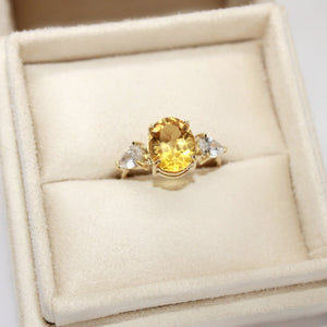 Three-Stone Engagement Ring in Yellow Gold with Orange Zirconia