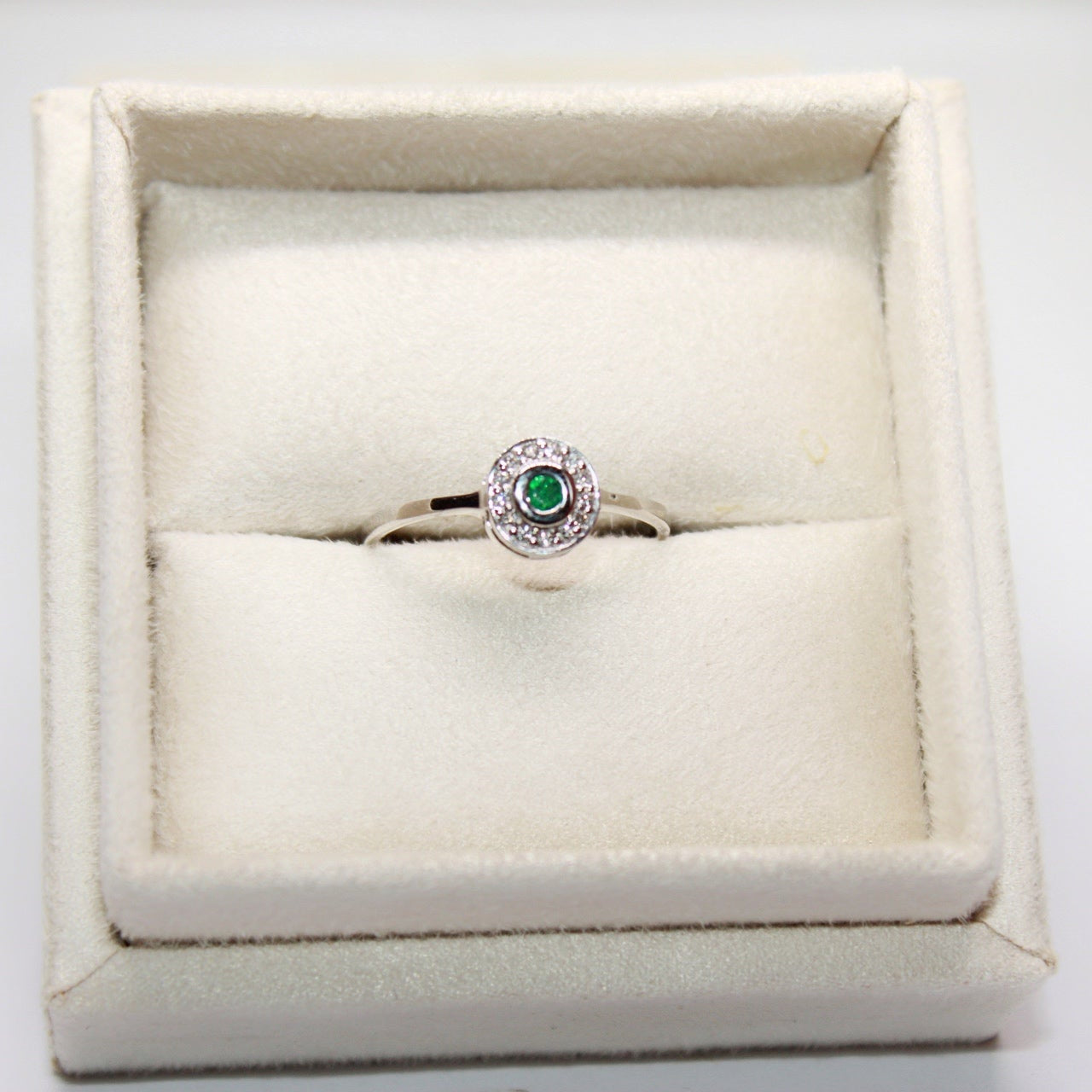 Emerald Engagement Ring with Diamond Halo in White Gold