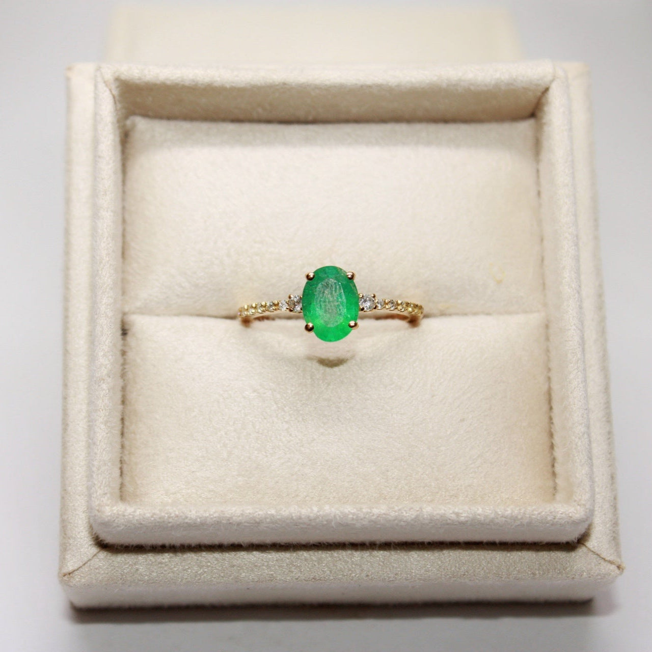 Oval Emerald Engagement Ring with Side Diamonds