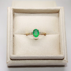 Oval Emerald Engagement Ring with Side Diamonds