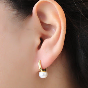 Timeless Pearl Huggie Earrings.