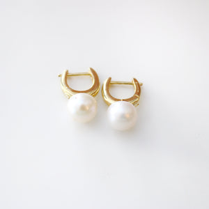 Timeless Pearl Huggie Earrings.