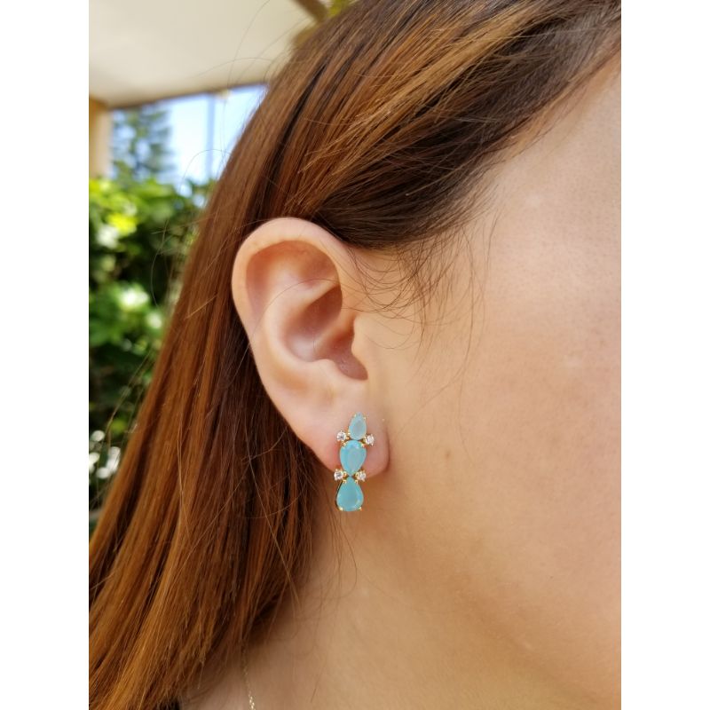 Woman with Earrings with blue crystals and zirconia