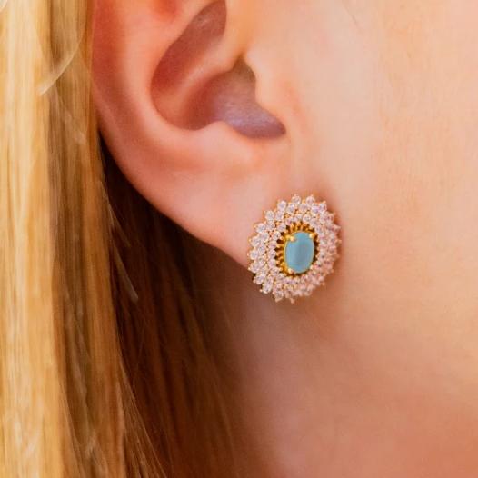 Woman with Earrings with zirconia and blue crystals