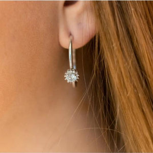 Women wearing zirconia and silver earrings with the gift box packaging