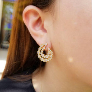 Woman with Chic crystal and zirconia earrings